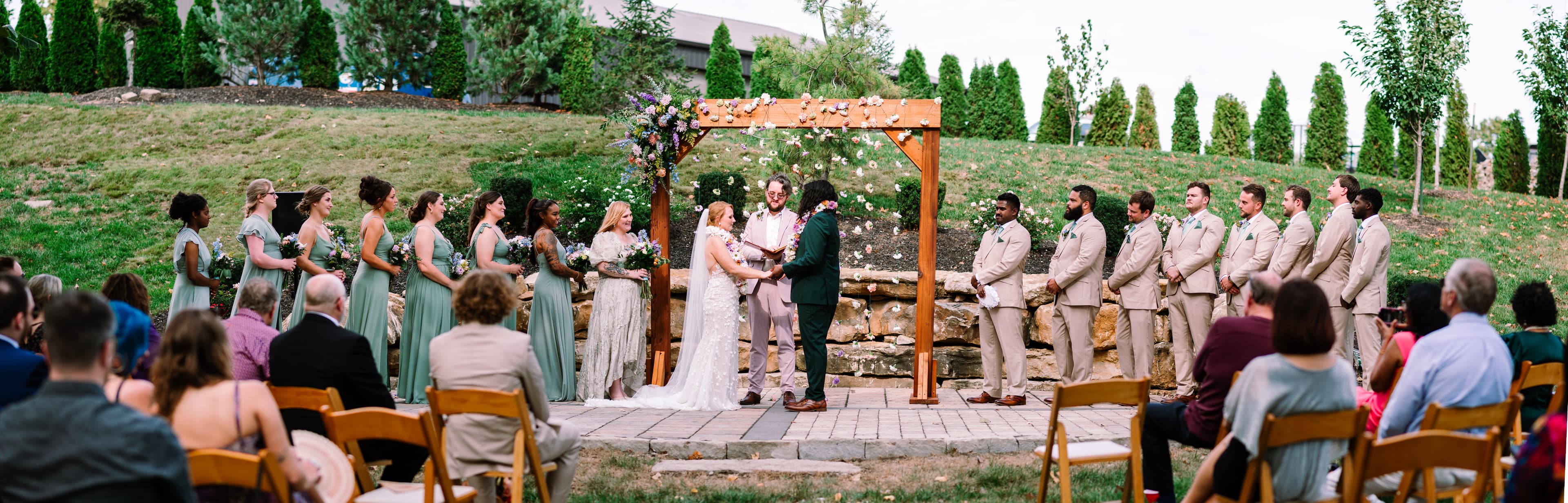 Garden terrace ceremony with natural backdrop