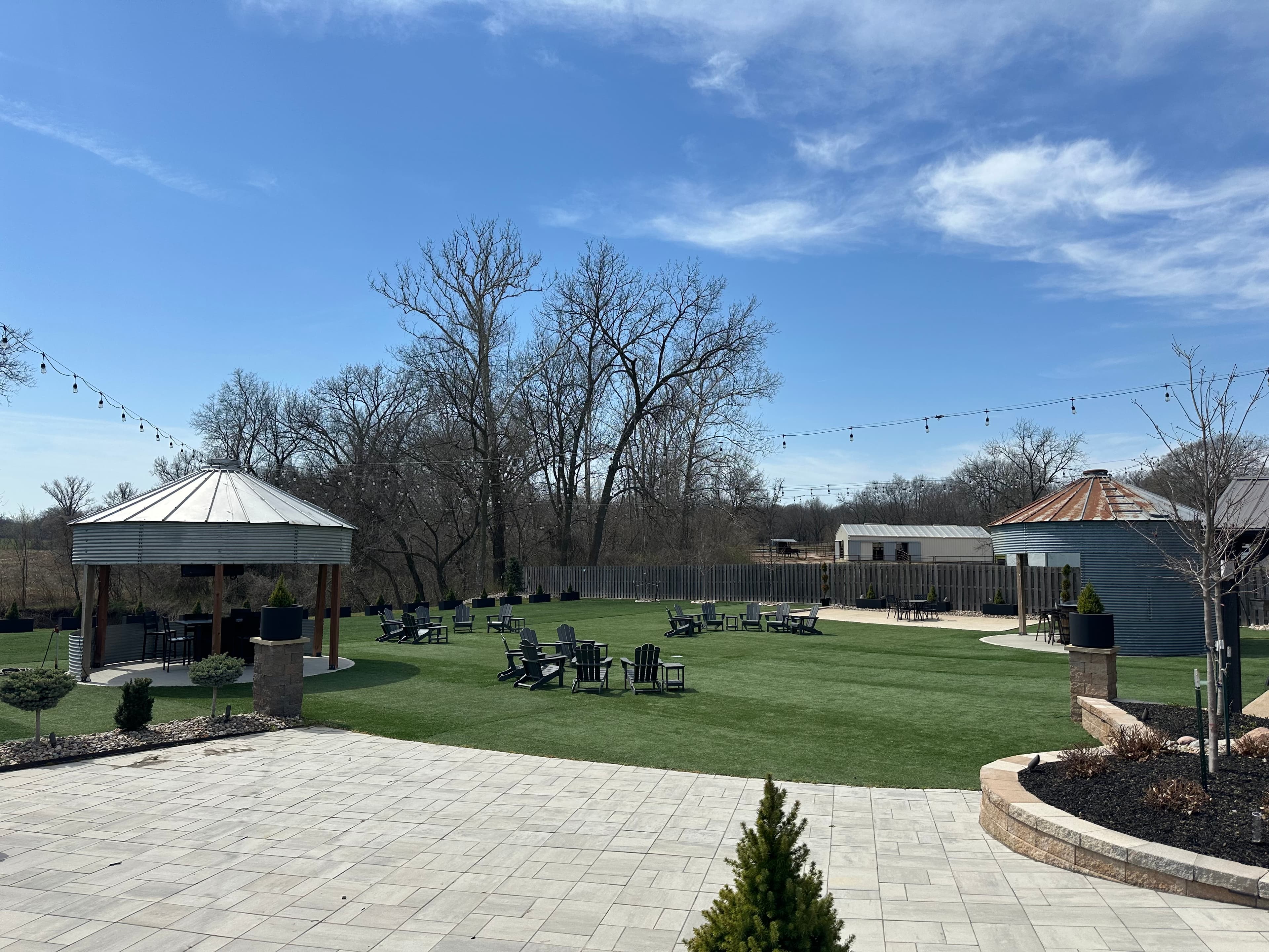 Outdoor venue grounds at Magnolia View with gazebo, lawn seating, and string lights